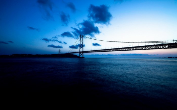Akashi Kaikyo Bridge at dusk over the ocean
