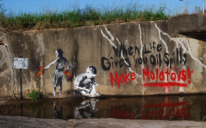 Graffiti on a concrete wall with children and text