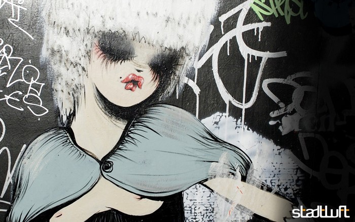 Graffiti illustration of a woman with white hair and red lips
