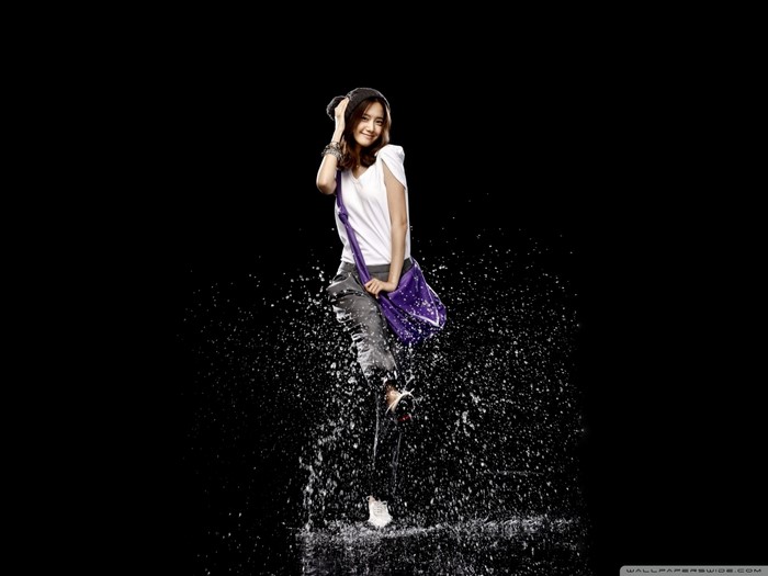 Woman dancing in water splashes