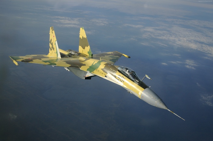 Russian Air Force Su-35S fighter jet flying over clouds