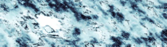 Abstract blue and white texture with dark speckles