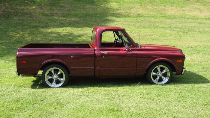 Maroon 1970s Chevrolet C10 Pickup Truck on Grass