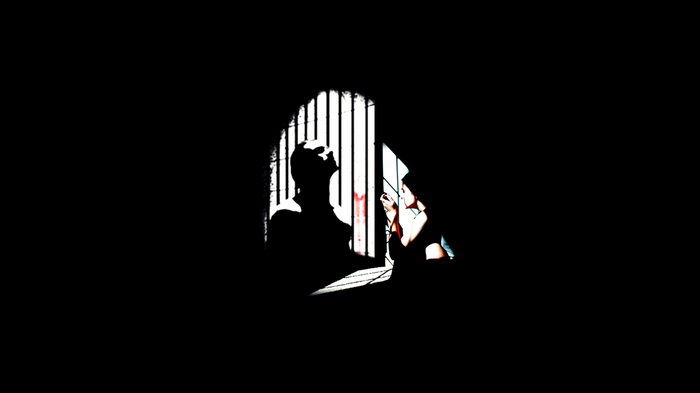 Silhouette of a person in a prison cell