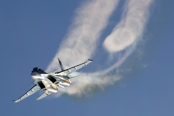 Sukhoi Su-30 fighter jet performing aerobatics
