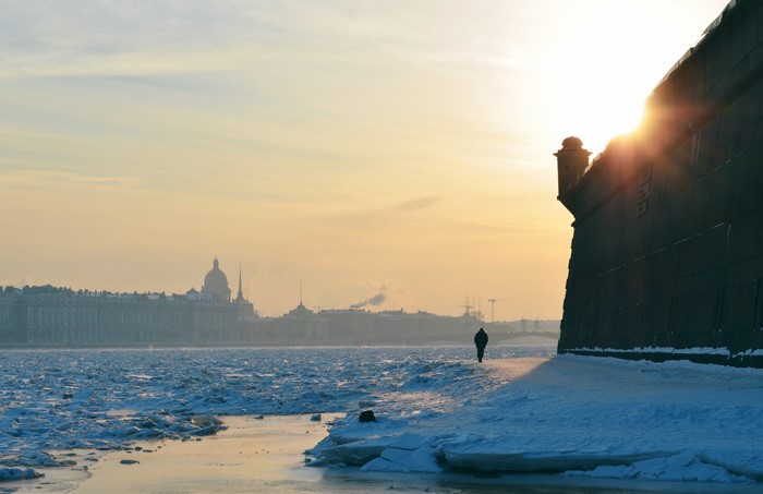 Winter sunset over St. Petersburg with ice on the Neva River