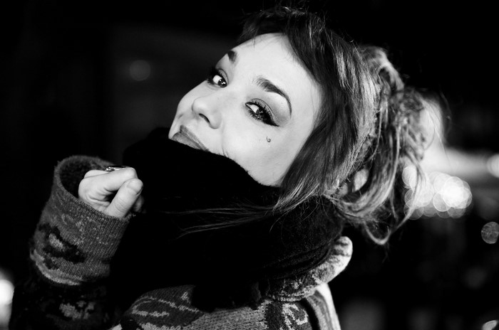 Woman with scarf and tear tattoo