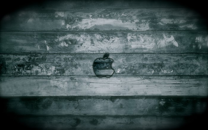 Apple logo on weathered wooden planks