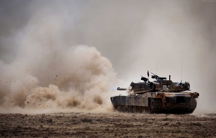 U.S. Army Abrams M1A1 tank in dust cloud