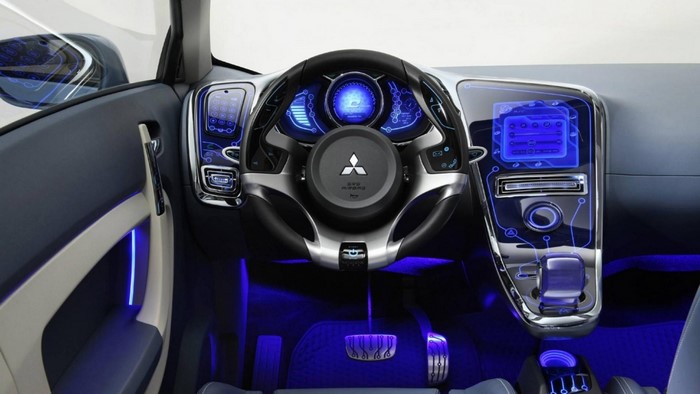 Futuristic car interior with blue lighting and digital displays