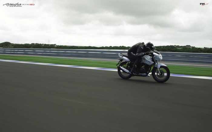 TVS Apache RTR 180 motorcycle on a race track