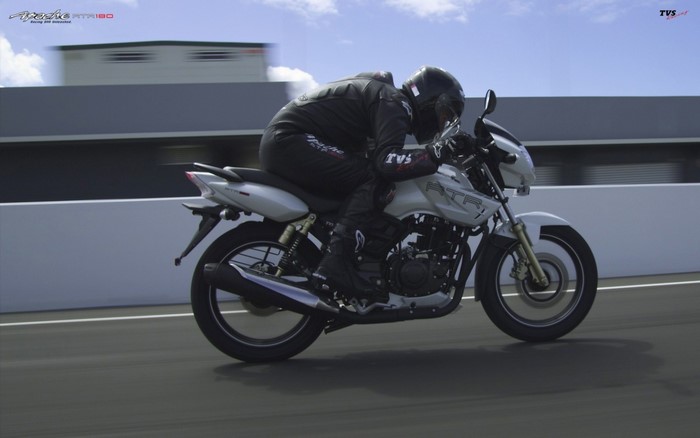 TVS Apache RTR 180 motorcycle with rider