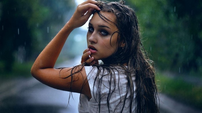 Woman with wet hair in the rain