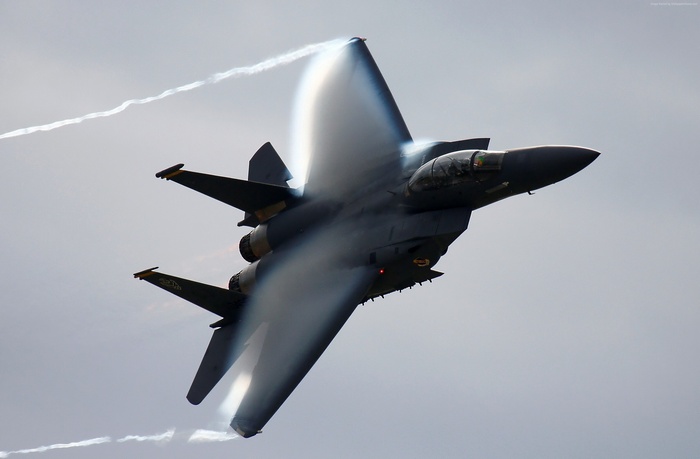 F-15 Eagle tactical fighter jet performing a maneuver