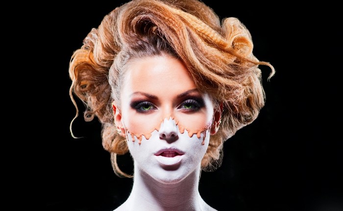 Woman with Halloween makeup and elaborate hairstyle