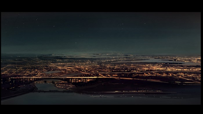 Cityscape at night with a bridge and stars