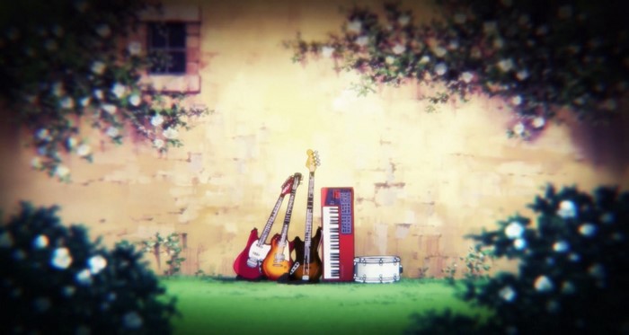 Guitars, Keyboard, and Drum against a Wall