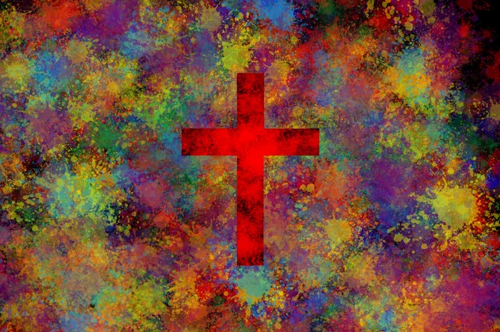 Red cross on colorful paint splatter background