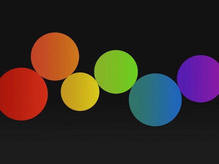 Rainbow colored circles on black background
