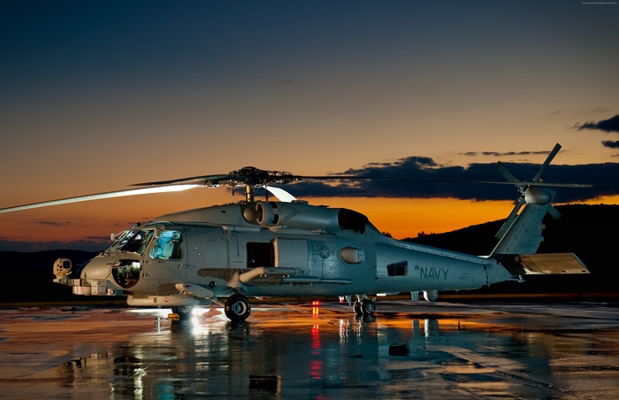 US Navy MH-60R Seahawk helicopter at sunset