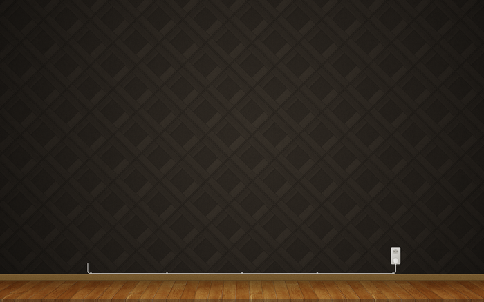 Dark patterned wall with wooden floor and electrical outlet