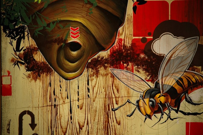 Painting of a wasp and a hive