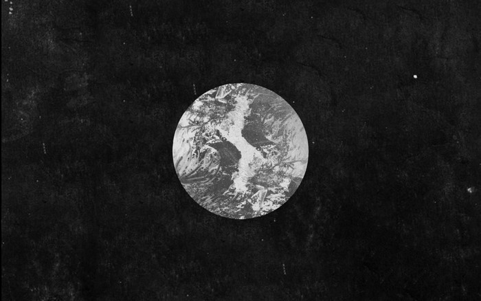 Monochrome circle with abstract pattern on black background