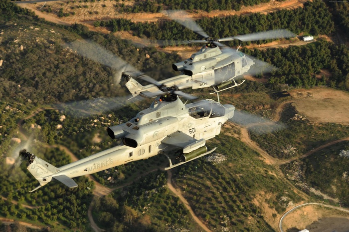 Two U.S. Marine AH-1Z Viper attack helicopters in flight