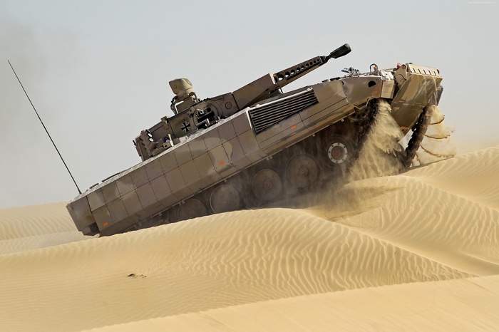 Bundeswehr Puma IFV driving through desert sand dunes