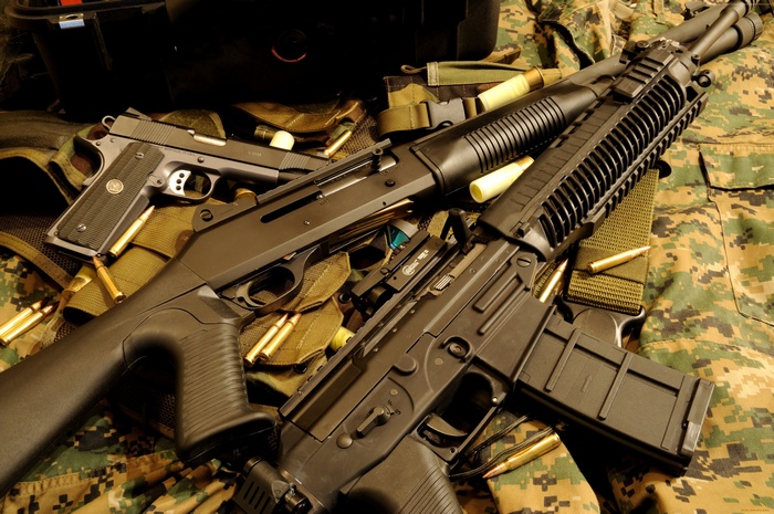 Benelli M4 Super 90 shotgun and pistol with ammunition