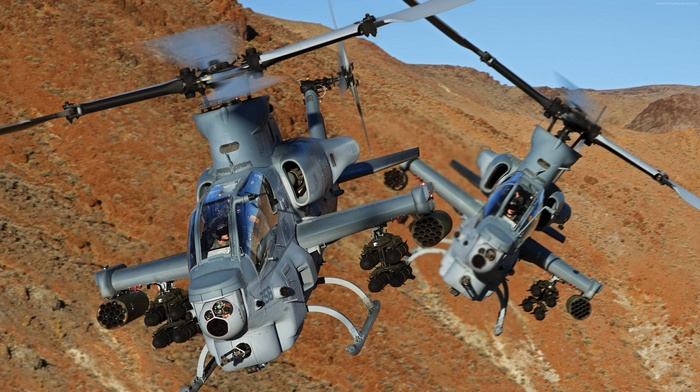 Two U.S. Marine AH-1Z Viper attack helicopters in flight