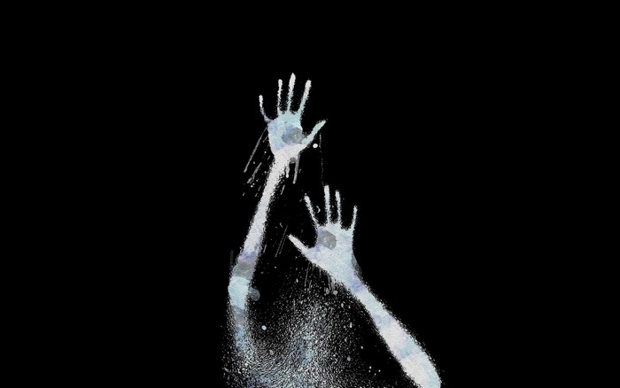 Abstract white hands reaching up from darkness