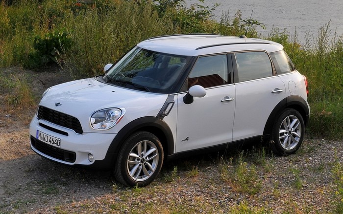 White Mini Countryman parked on gravel near water