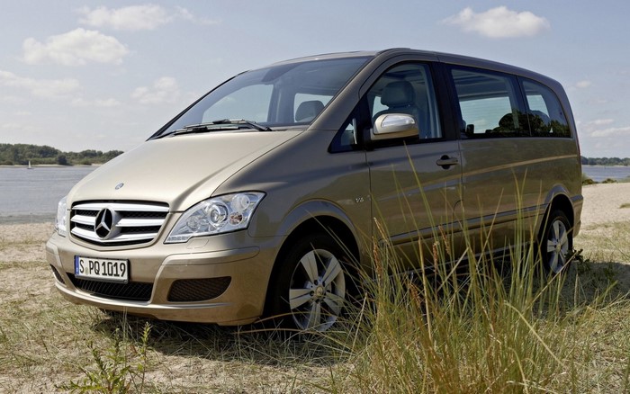 Mercedes-Benz Viano parked on a sandy shore