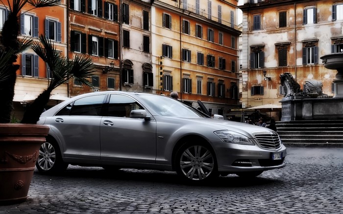 Silver Mercedes-Benz S-Class Sedan on Cobblestone Street