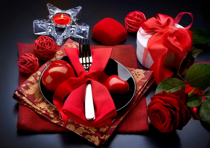 Valentine's Day table setting with rose and gifts