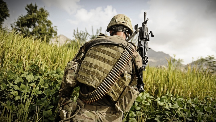 Soldier with MK-48 machine gun and ammunition belt