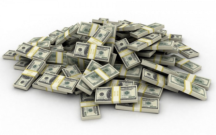 A large pile of US dollar bills