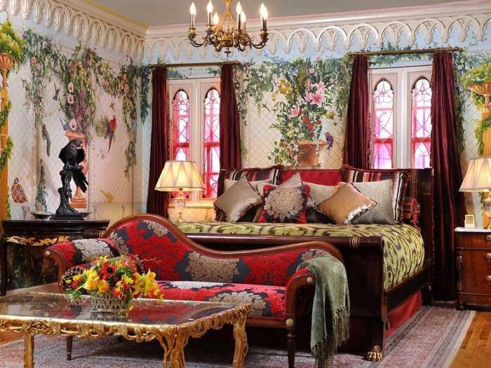 Ornate bedroom with floral mural and chaise lounge