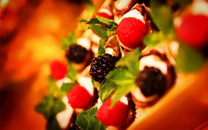 Dessert with berries and mint