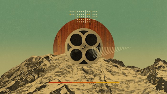 Film reel on mountain with abstract elements