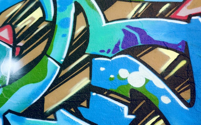 Graffiti mural with abstract shapes and colors