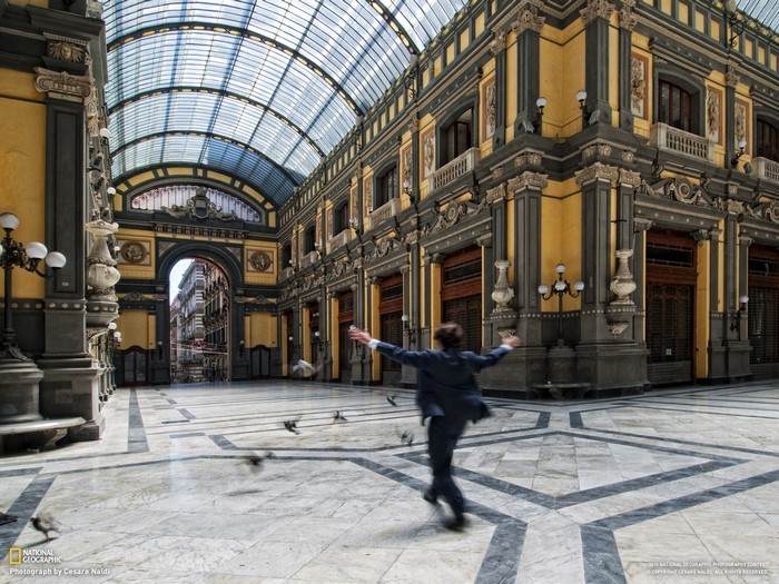 Man running through Galleria Umberto I, Naples