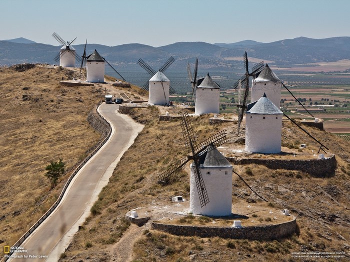 Windmills on a hill with a road