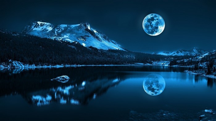 Serene Nightscape with Full Moon Over Mountains