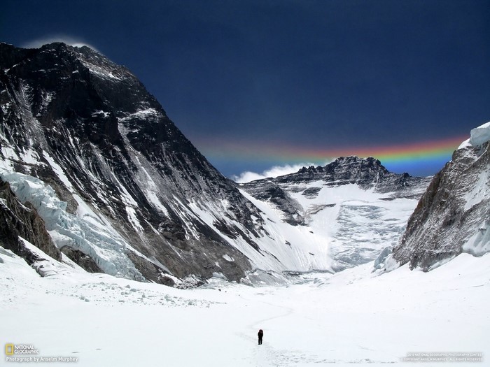 Mount Everest with a rainbow over the summit