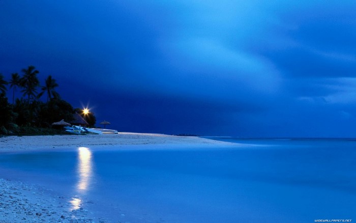Beach at dusk with ocean reflection