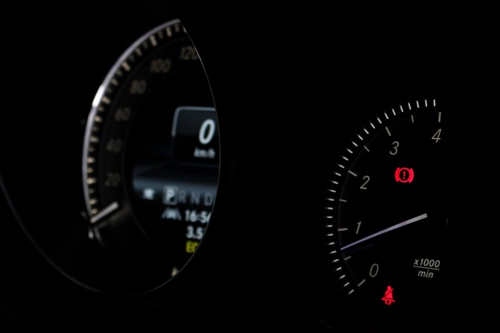 Car dashboard with speedometer and tachometer