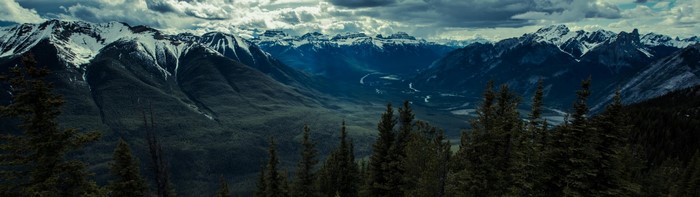 Panoramic view of snow-capped mountains and a valley