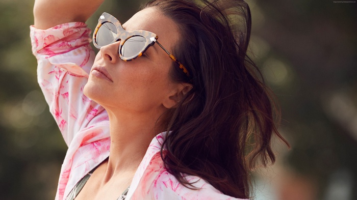Evangeline Lilly wearing sunglasses and floral shirt